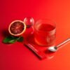 Eimele Calibrate Reds Red Orange Drink Eimele Calibrate Reds with red orange, sachet and prepared drink
